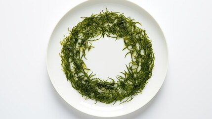 Poster - seaweed placed on a white round plate, photographed from a top-down perspective against a white backdrop