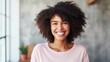 © Matcha_09 - Indoor portrait of beautiful brunette young dark-skinned woman with shaggy hairstyle smiling cheerfully, showing her white teeth to camera
