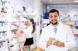 © JackF - Male pharmacist checking assortment of drugs in pharmacy