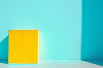 Poster - A vibrant yellow rectangle contrasts against a stark blue wall, creating an abstract explosion of colorfulness