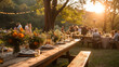 Guests mingle at an outdoor wedding reception, with rustic tables set in warm sunset light, adorned with fresh flowers and festive string lights.
