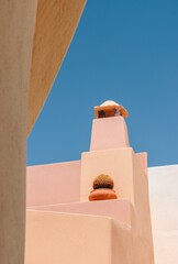 Wall Mural - pastel colored building in Emborio, Santorini, Cyclades, Greece