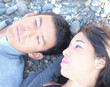 Man And Woman Portrait Outdoors On Rocky Beach