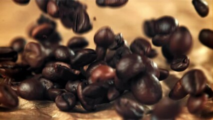 Poster - Coffee beans fall on old paper. Filmed on a high-speed camera at 1000 fps. High quality FullHD footage