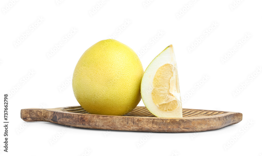 Wooden board with fresh pomelo fruits on white background