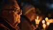 Old man with HIV/AIDS joining a candlelight vigil with loved ones and supporters