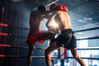© Kawee - Two young professional boxer having a competition tournament on stage.