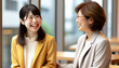 © Purple White - 20代のダウン症の女性会社員が同僚と談話している