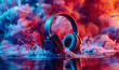 Headphones in an abstract vibrant colorful ink drop in the water background. Creative commercial music concept.