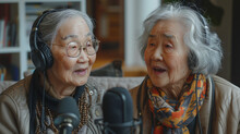 Portrait of two Asian women recording a podcast at home with mic and headset , modern elderly people participating to new technology being in tune with their time