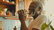 Happy elderly black man drinks pure water in kitchen