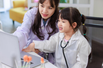 Wall Mural - Asian woman teacher and little children girl reading laptop computer for data learning science at chemical laboratory study room. Education research and development concept learning for kids.