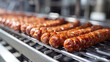 Production of smoked sausages in a factory, food industry concept