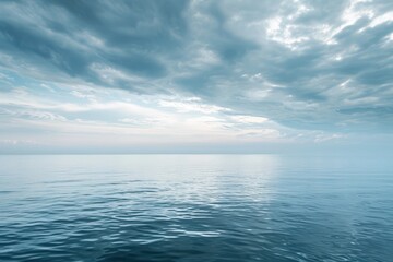 An expansive body of water stretches across the horizon, reflecting the cloudy sky as the sun sets, Calm sea horizon under minimal cloudy sky, AI Generated