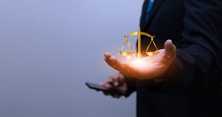 Hands of a businessman or lawyer with legal services icons For online legal advice on labor law for business law firms. The concept of legal advisors and lawyers