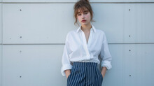 A Crisp White Buttonup Shirt Tucked Into Highwaisted Pinstripe Trousers In Varying Shades Of Blue Exudes A Sense Of Professional Yet Contemporary Style. This Outfit Is Ideal