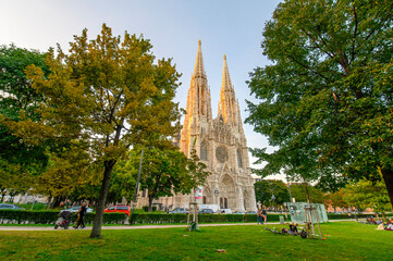 Wall Mural - Votivkirche or Votive Church in Vienna, Austria. Famous Neo-Gothic church on Ringstrasse - second-tallest church in Wien. Church consecrated in 1879 on occasion of Imperial Couple's Silver Wedding.	
