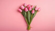 Beautiful composition spring flowers. Bouquet of pink tulips flowers on pastel pink background. Valentine's Day, Easter, Birthday, Happy Women's Day, Mother's Day.
