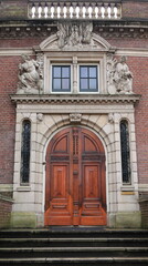 Wall Mural - Amsterdam Royal Tropical Institute Building Entrance with Sculpted Decoration, Netherlands