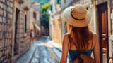 Fototapeta Uliczki - Beautiful tourist young woman walking in Dubrovnik Ragusa city street on summer, Croatia, tourism travel holiday vacations concept in Europe