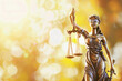 © KidSpace - Lady justice statue with golden background. Law and legislation concept.