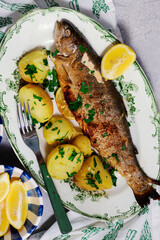 Wall Mural - Fried rainbow trout with boiled potatoes..style hugge.