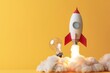 © Deivison - Rocket next to a light bulb, startup concept, idea and creativity, yellow background.