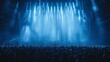 © Zaleman - Stage lights in blue tones, people silhouette on a dance floor during a concert festival in a crowded concert hall