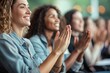 © LifeMedia - A group of enthusiastic women clapping hands at a seminar or conference, expressing positivity and engagement