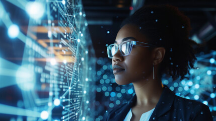 Black woman working in office and futuristic graphical user interface concept. ICT (Information Communication Technology). System engineering.
