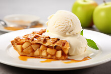 Apple strudel with ice cream and caramel sauce on white plate