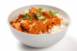 Chicken tikka masala with rice in bowl on white background