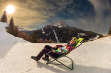 Woman Relaxing After Ski, Dolomites, Italy