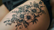 Flower tattoo on a woman's thigh