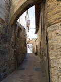 Fototapeta Na drzwi - Italian medieval street in Tuscany