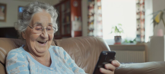 Elderly people in the digital age concep, Grandma holding the smartphone in browsing wireless Internet, looking at screen, chatting in social network or shopping online, relax at home.