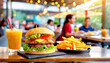 Hamburger mit Pommes im Vordergrund, ein Restaurant Aussengastronomie und glücklichen Menschen im Hintergrund 