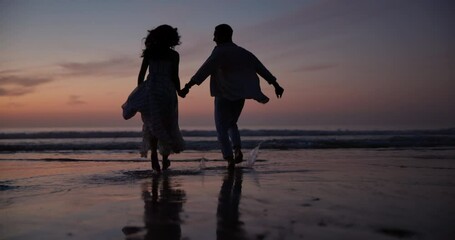 Canvas Print - Sunset, holding hands and shadow of couple at beach on vacation, adventure or holiday for romantic date. Love, silhouette and back of people run on tropical weekend trip for valentines day together.