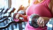 Close up overweight mature elderly middle aged woman in the gym preparing to play sports, the concept of an active life in old age, taking care of the body and building a relationship with weight