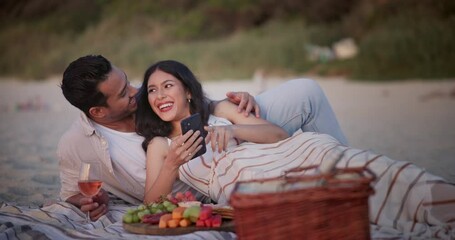 Wall Mural - Happy couple, picnic and beach for selfie, photography or memory together on date, picture or outdoor bonding. Man and woman with smile in relax for photo or capture moment by fruit basket on blanket