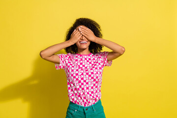 Sticker - Photo of positive nice lady hands palms cover eyes do not look empty space isolated on yellow color background