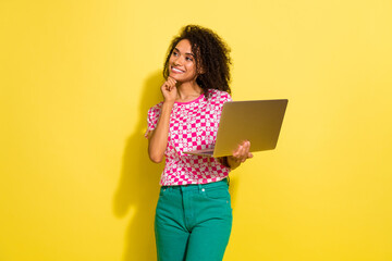 Poster - Photo of charming minded lady hold laptop arm touch chin look empty space brainstorm isolated on yellow color background