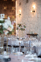 Wall Mural - Luxury wedding table setting with flower centerpieces and candles