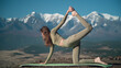 Flexible girl is doing yoga on the background of mountains.