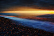 Twilight landscape of sea stone coast at sunset