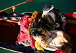 Venice, VE, Italy - February 13, 2024: married couple with historical costumes on the gondola during the carnival