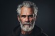 © Igor - Portrait of a handsome senior man with grey beard and mustache.