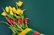Congratulation for March 11, Lithuania Independence Day. Lithuanian tricolor and bouquets of tulips