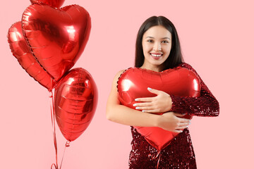 Sticker - Young Asian woman with heart-shaped air balloons on pink background. Valentine's day celebration