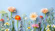 Assorted Spring Flowers Arranged on a Calm Blue Background